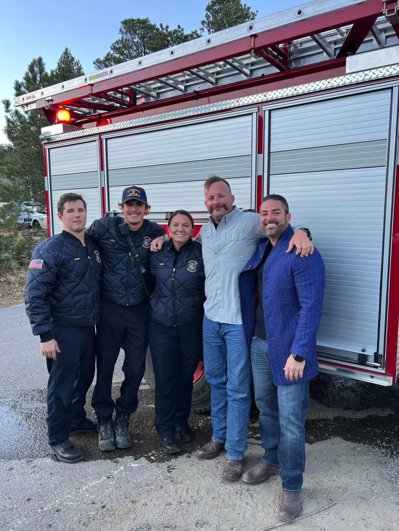 Rico Leon with the Evergreen fire rescue crew beside their engine